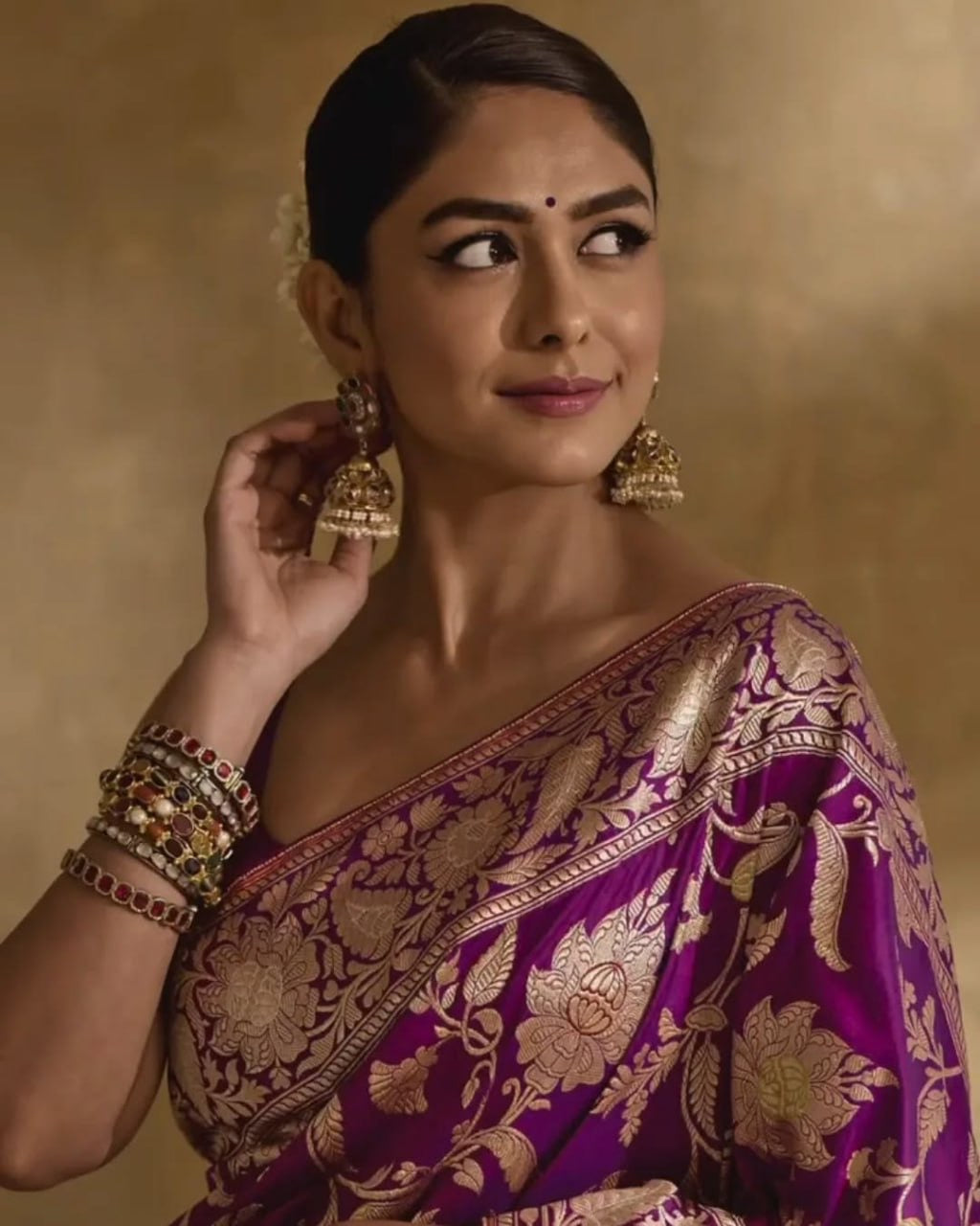 Regal Purple Banarasi Silk Saree with Intricate Golden Zari Floral Weaves