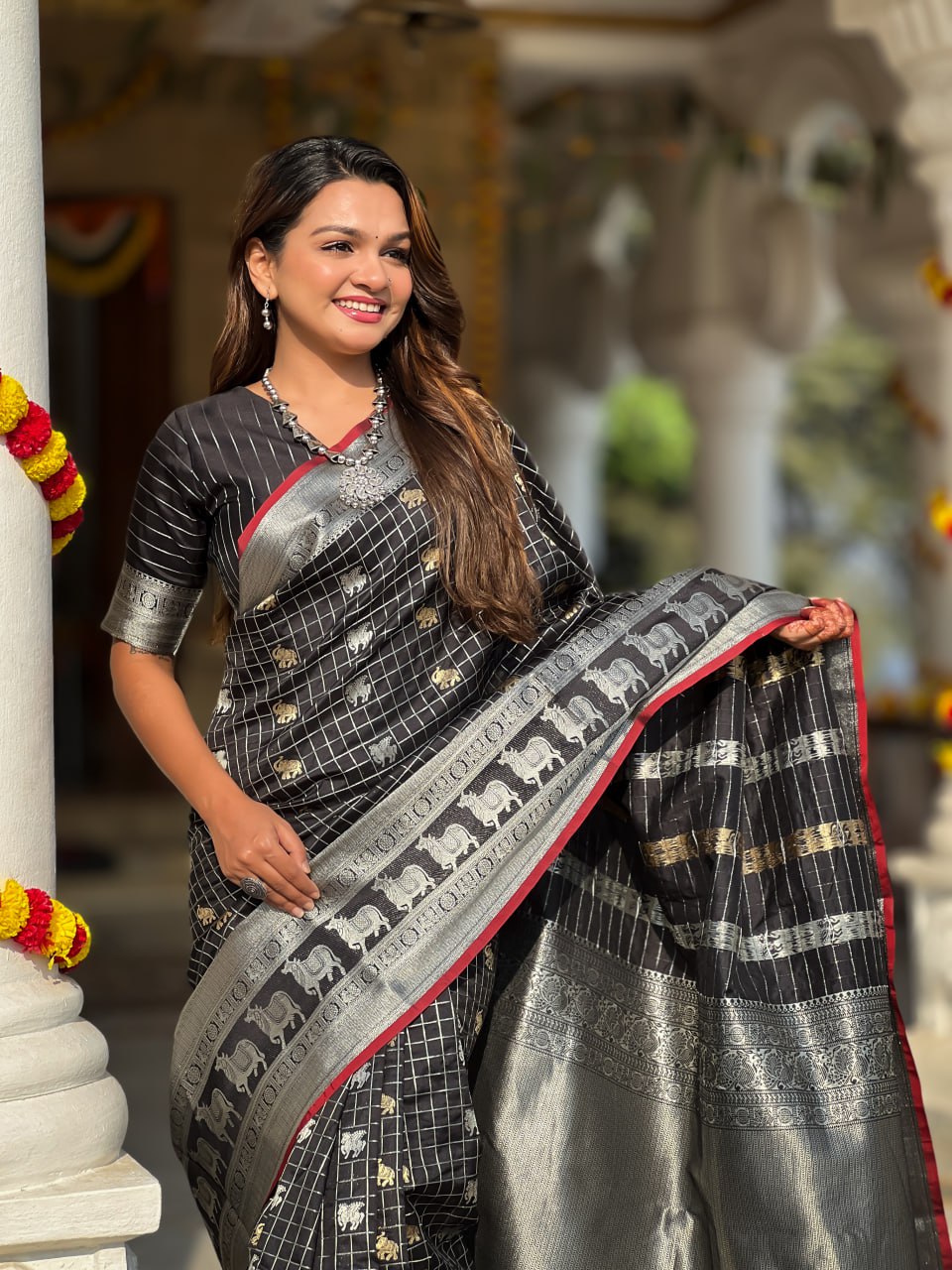 Majestic Black Silk Saree with Silver & Gold Zari Animal Motifs