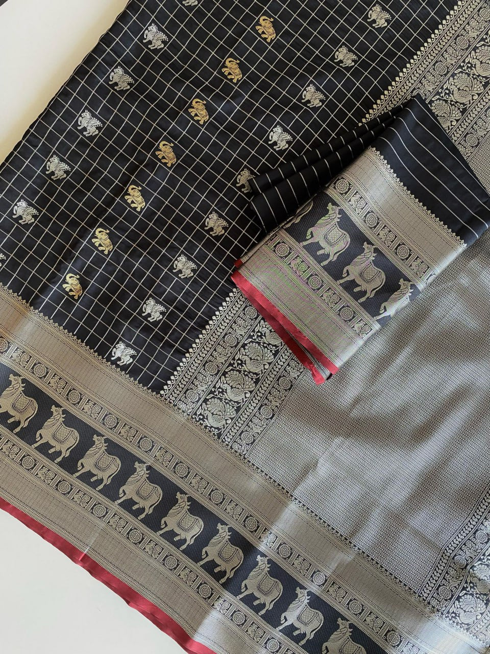 Majestic Black Silk Saree with Silver & Gold Zari Animal Motifs