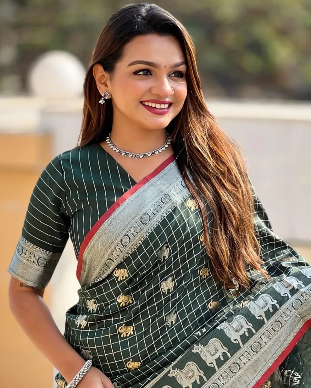 Elegant Bottle Green Silk Saree with Silver-Gold Zari Animal Motifs