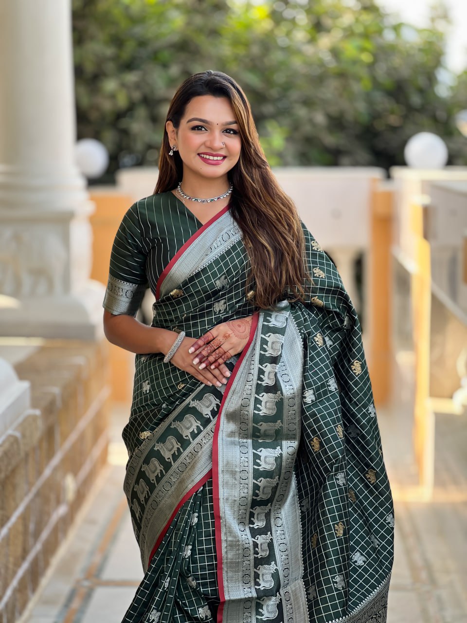 Elegant Bottle Green Silk Saree with Silver-Gold Zari Animal Motifs