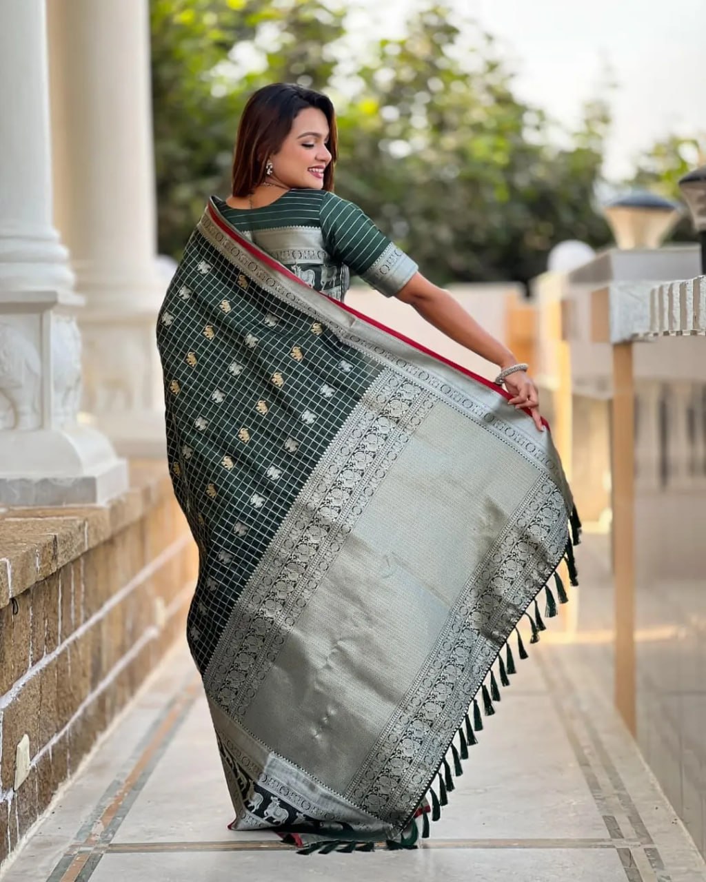 Elegant Bottle Green Silk Saree with Silver-Gold Zari Animal Motifs