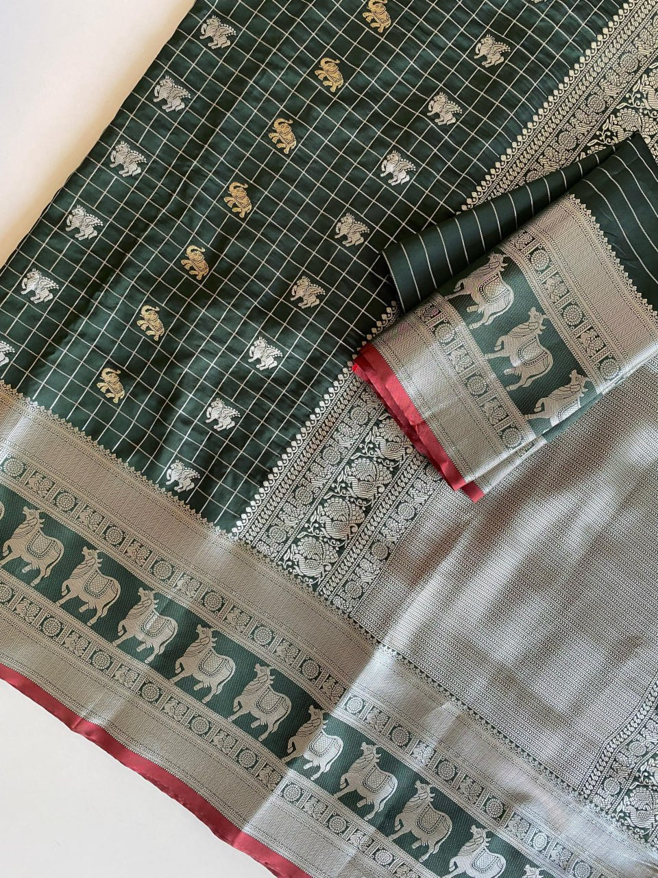 Elegant Bottle Green Silk Saree with Silver-Gold Zari Animal Motifs