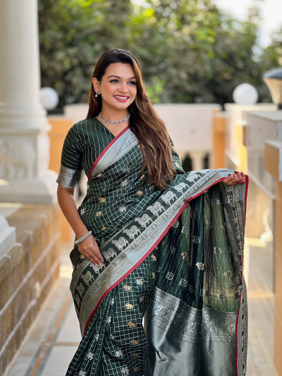 Elegant Bottle Green Silk Saree with Silver-Gold Zari Animal Motifs