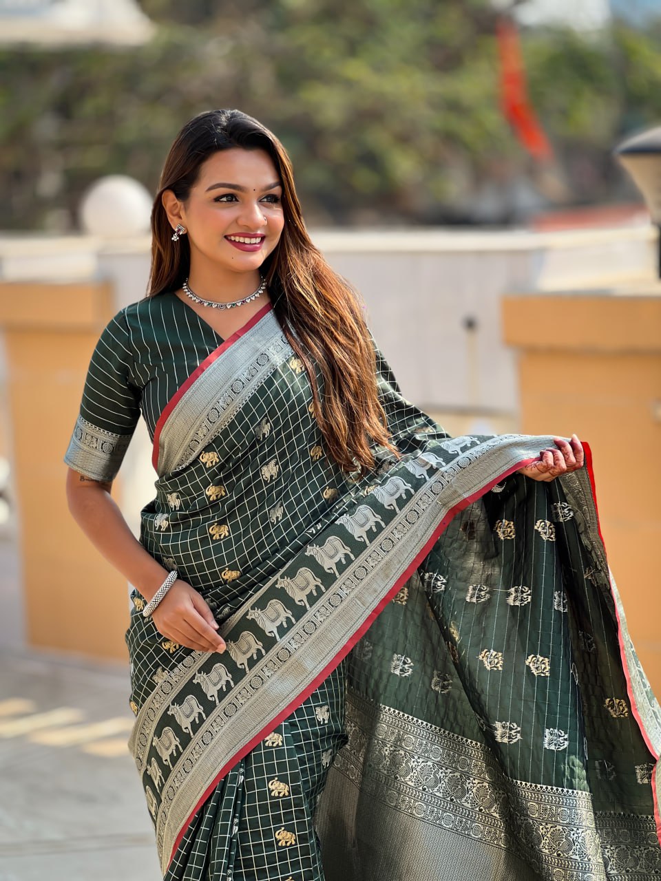 Elegant Bottle Green Silk Saree with Silver-Gold Zari Animal Motifs