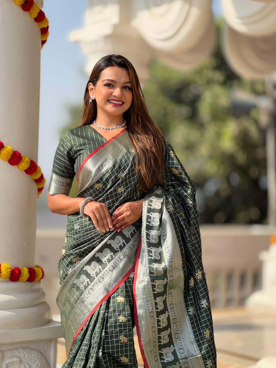 Elegant Bottle Green Silk Saree with Silver-Gold Zari Animal Motifs