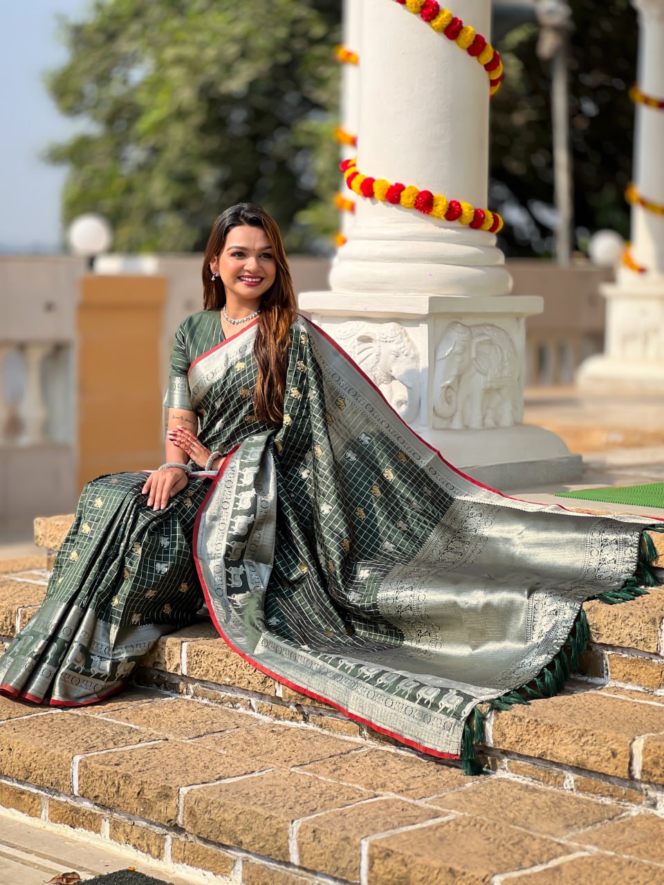 Elegant Bottle Green Silk Saree with Silver-Gold Zari Animal Motifs